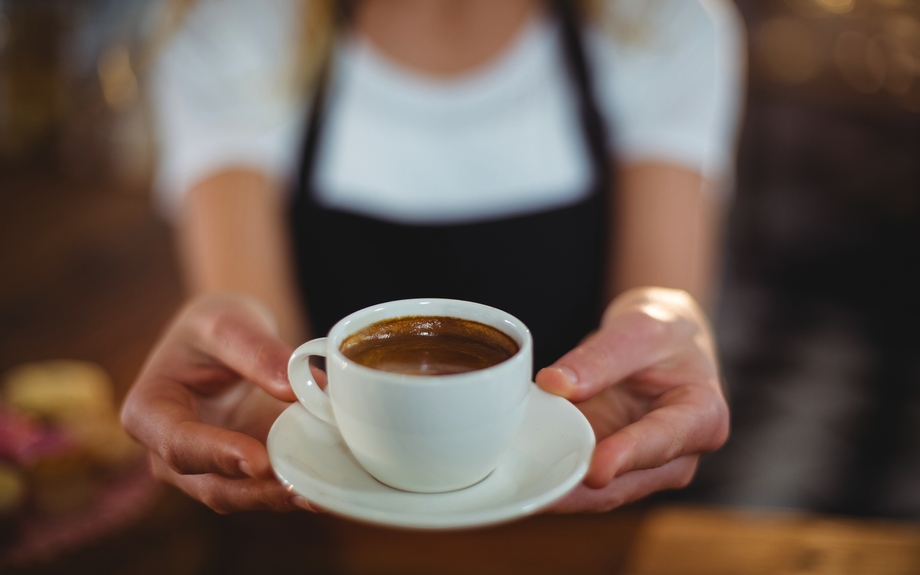 Waitress offering a cup of coffee